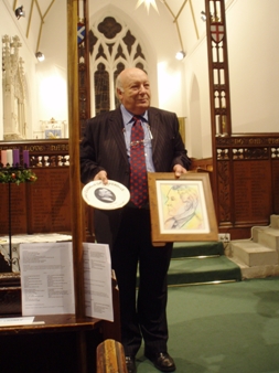 Lord Cadman the third (grandson) receives a memorial plate and a portrait of his grandfather done/organised by local schoolchildren of Silverdale. Photo: Shirley Torrens.